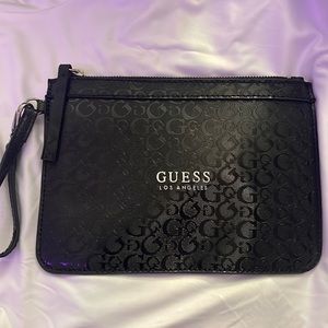 A black guess wristlet